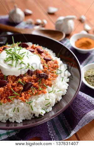 Mexican food Chili con carne on a wooden background