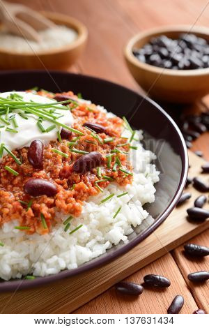 Mexican food Chili con carne on a wooden background
