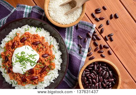 Mexican food Chili con carne on a wooden background