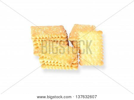 Stacked butter biscuits with sesame in white plate isolated on white background