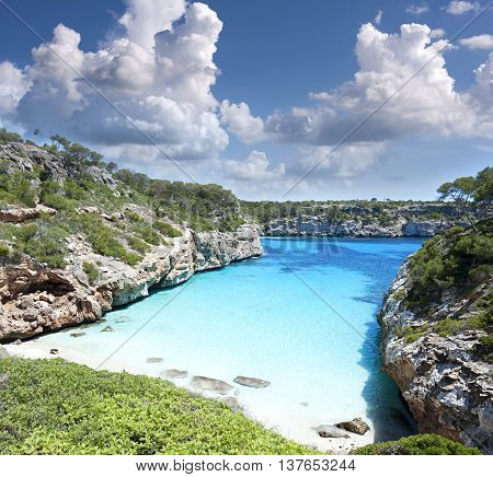 Beautiful turquoise clear water of mediterranean at Majorca beach Calo des Moro Spain