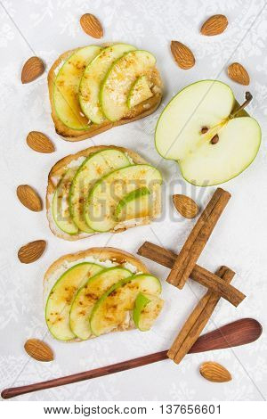 Three sweet toasts with cheese apples cinnamon and honey