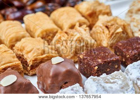 Oriental sweets on a white plate. Turkish or greek delight