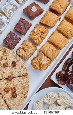 Oriental sweets on a white plate. Turkish or greek delight
