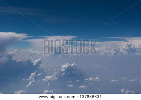 Beautiful blue sky and cloud view from an airplane window.
