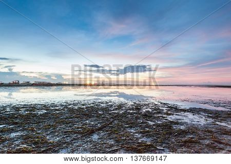 Holiday in Bali, Indonesia - Reflection Sunrise in Tanjong Benoa with boat