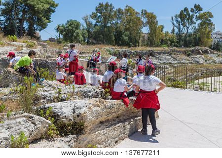 SIRACUSA ITALY - MAY 18: School pupils visiting the Greek theatre of Syracusa on May 18 2016 at the island Sicily Italy