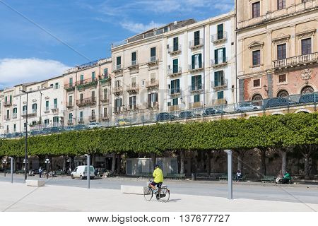 SIRACUSA ITALY - MAY 18: City of Syracusa with passing cyclist on May 18 2016 at the island Sicily Italy