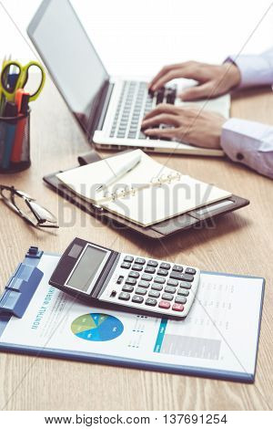 Man Analysis Business on wood desk.  Accounting