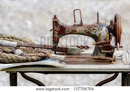 Old sewing machine used in floral arrangement in park of attraction in Zator, Poland. 8 JULY 2016, ZATOR. POLAND.
