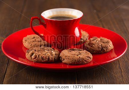 Coffee Cup And Amaretti Biscuits On Wooden Background.