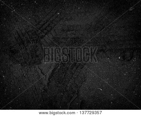 Tire tracks on the road gravel stone background