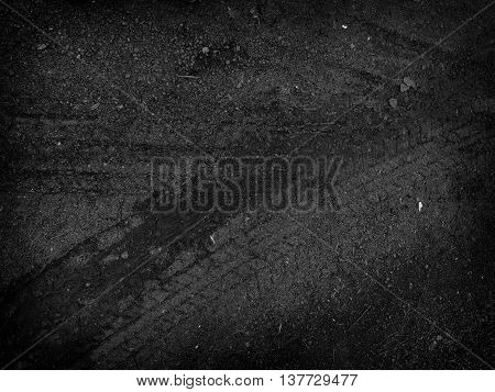 Tire tracks on the road gravel stone background