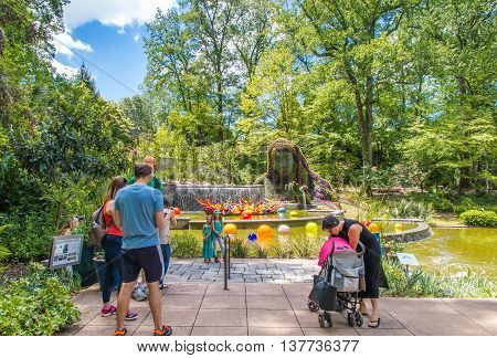 ATLANTA GA USA - APRIL 23 2016: Exhibition of glass artist Chihuly takes place in the Atlanta Botanical Garden in Atlanta Georgia in 2016.