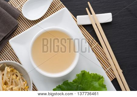 Top view of a Chinese salad dressing made with rice vinegar and sugar.