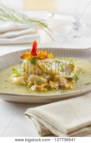 Cocochas (in basque kokotxas) refer to the flesh under a fish's jaw. Due to their high gelatinous content they make a fantastic broth. They are usually prepared with olive oil garlic and parsley.