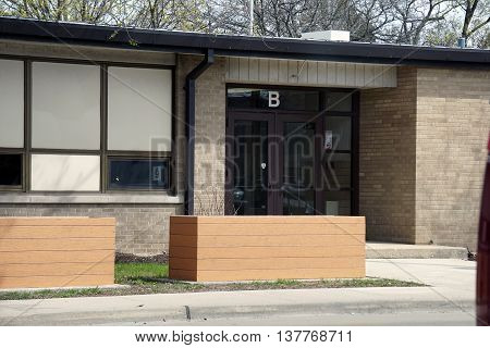 PLAINFIELD, ILLINOIS / UNITED STATES - APRIL 18, 2016: Entrance B of the Plainfield Elementary School, which offers education to children in Plainfield, Illinois.