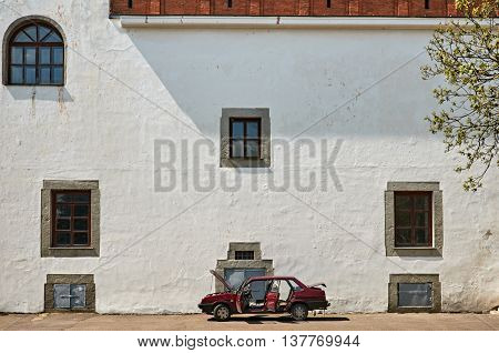 old castle wall with windows blue sky. Ukraine Dubno Carpathian