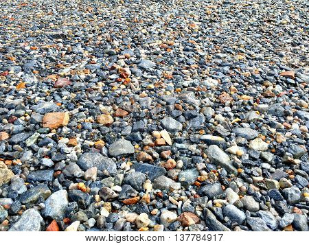 A lot of pebble stone on the floor.