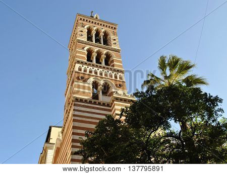 bottom view of the church with palm trees
