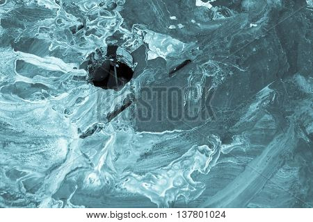 the spotty textured and indistinct abstract blue background with a hole