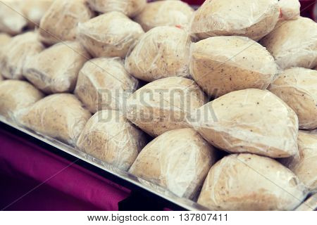 cooking and asian kitchen concept - food sale at street market
