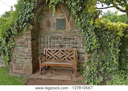 Romantic nook with wood bench and hedge for repose (people in love), South Africa
