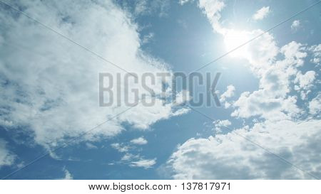 bright blue sky with cloud and sun background