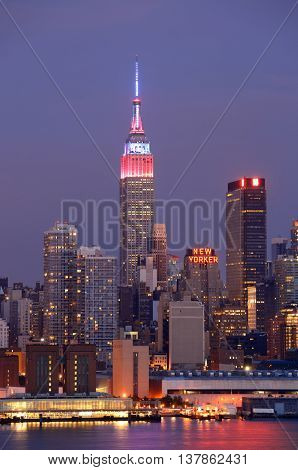 NEW YORK CITY - JUL 4: Empire State Building with skyscrapers on July 4, 2015 in Manhattan, New York City. With population of 8.4M, it is the most populous city in the United States.