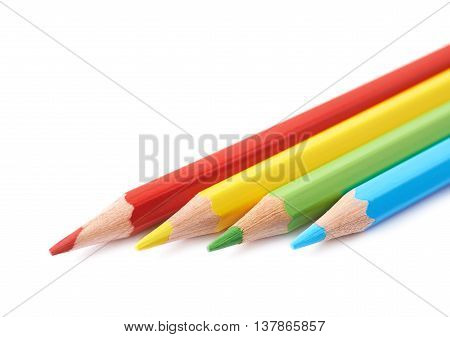Four colorful drawing pencils composition isolated over the white background, close-up crop fragment