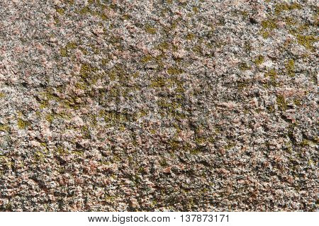 Brown granite texture. Natural rough untreated and unpolished stone wall with grain surface, abstract background