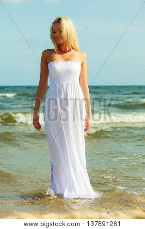 Attractive Blonde Woman On The Beach.