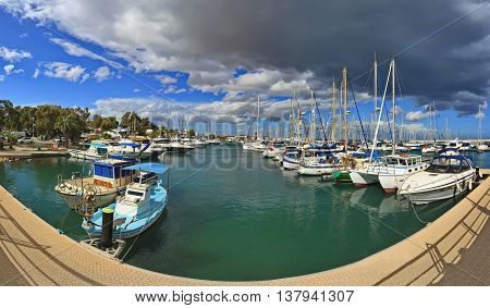 CYPRUS, LARNACA - MARCH 14, 2016: The numerous fishing boats, tourist ships and luxury yachts moored in Larnaca marina, Cyprus.