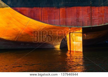 Ship moored at quay in port - view from the stern.