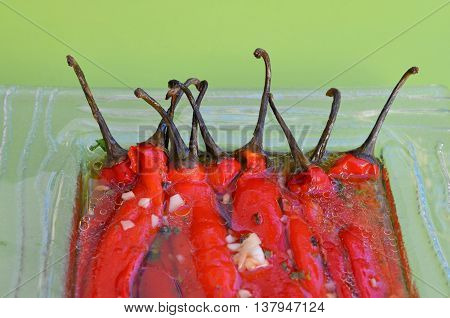 Sour salad of red peppers and garlic in marinade