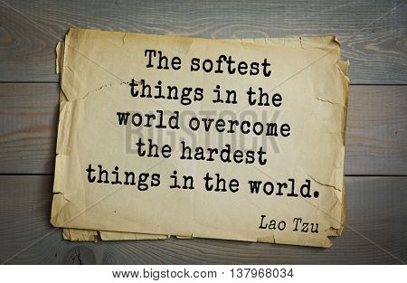 Ancient chinese philosopher Lao Tzu quote on old paper background. The softest things in the world overcome the hardest things in the world.