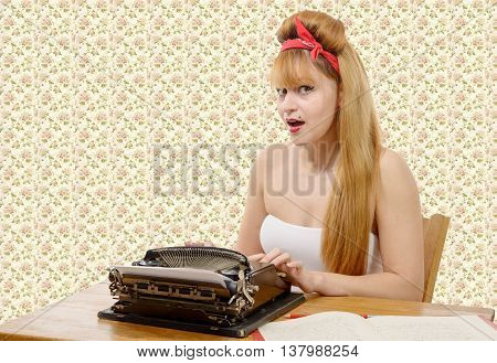 sexy young pinup girl with old typewriter