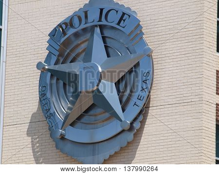 Dallas, USA, 08 July 2016. In the afterman of Thursdays shootings memorials are placed in from the the Jack Evans Police Headquarters in Dallas. There are two cars. One Dallas Police and one Dallas Area Rapid Transit (DART).in Dallas on Thursday July 7 20
