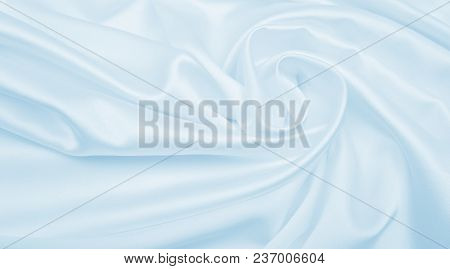 Smooth Elegant Blue Silk Or Satin Luxury Cloth Texture As Abstract Background. Luxurious Background