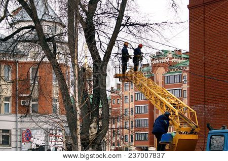 Power Plant Workers Repair Wires In The City