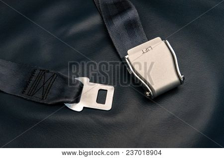 Seat Belt On Seat Shot In Airplane. Dark Tone And Selective Focus. Unfastened Seat Belt. Concept Of 