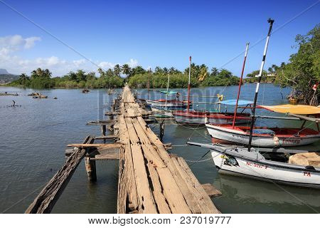 Baracoa, Cuba - February 12, 2011: Boats By Rio Miel Footbridge In Baracoa. The Area Is Part Of Alej