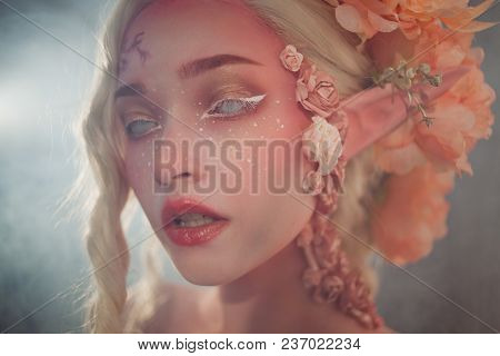 Young Beautiful Girl. Attractive Elf Close-up. Creative Pink Makeup. Fantasy And Fairy Tale.