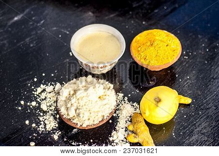 Chana,haldi,limbo Ka Ubtan Or Ayurvedic Face Pack Of Turmeric, Lemon, And Gram Flour On Wooden Surfa