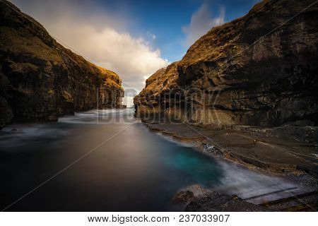 Little Harbour Of Gjogv Village Between Sharp Cliffs, Faroe Islands
