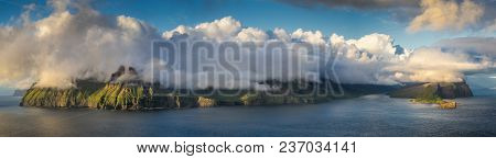 Vagar And Tindholmur Islands Under Big Cloud In Sunset, Faroe Islands