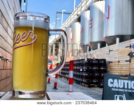 KENTISH TOWN, LONDON - APRIL 20, 2018: A pint of Hells beer at The Camden Town Brewery in Kentish Town, North London, UK.