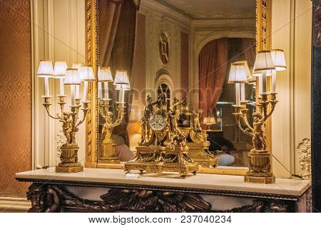 Utrecht, Northern Netherlands - June 28, 2017. Luxurious Golden Clock Over Shelf In De Haar Castle B