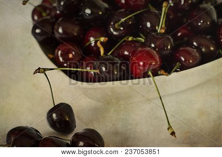 Beautiful Juicy Fresh Summer Cherries In A White Bowl On A Vintege Background