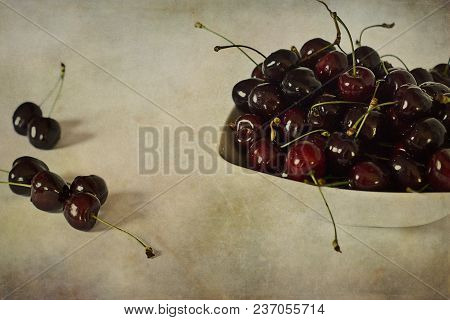Beautiful Juicy Fresh Summer Cherries In A White Bowl On A Vintege Background